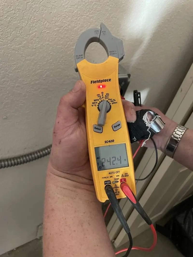 Voltage testing with clamp meter during Ceiling Fan Installation in Coxsackie